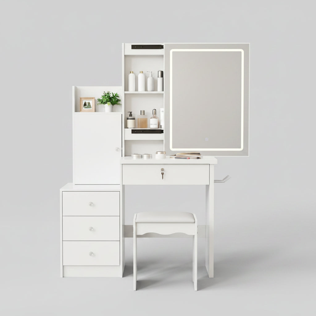 A white vanity desk set with a built-in black-framed mirror, three drawers, open shelving, and a matching white stool, styled in a beige room with decorative accessories.