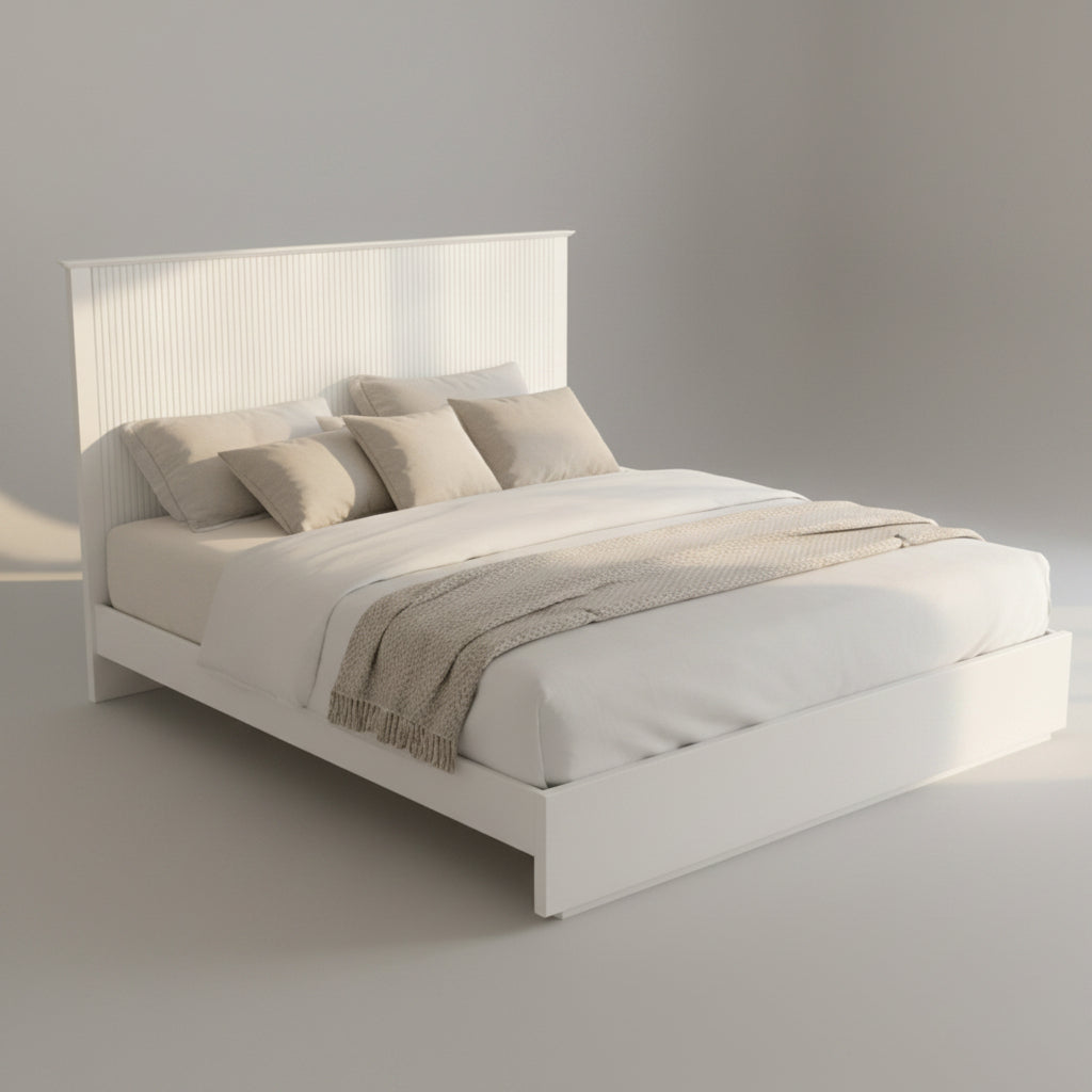 Neatly made bed in a bright bedroom with decor elements.