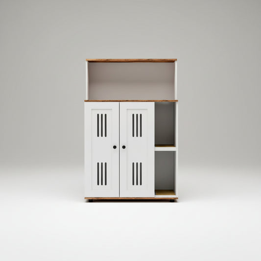 A modern white storage cabinet with two doors, featuring vertical vent slits, black knobs, open side shelves, and a warm wood-look top and shelf trim. The cabinet is styled in a bright, minimalist room next to a white armchair with a textured throw blanket.