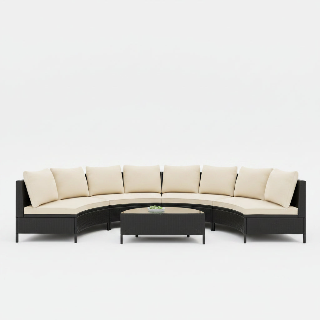 Outdoor patio furniture set with beige cushions on a patio with a modern house and palm trees in the background.